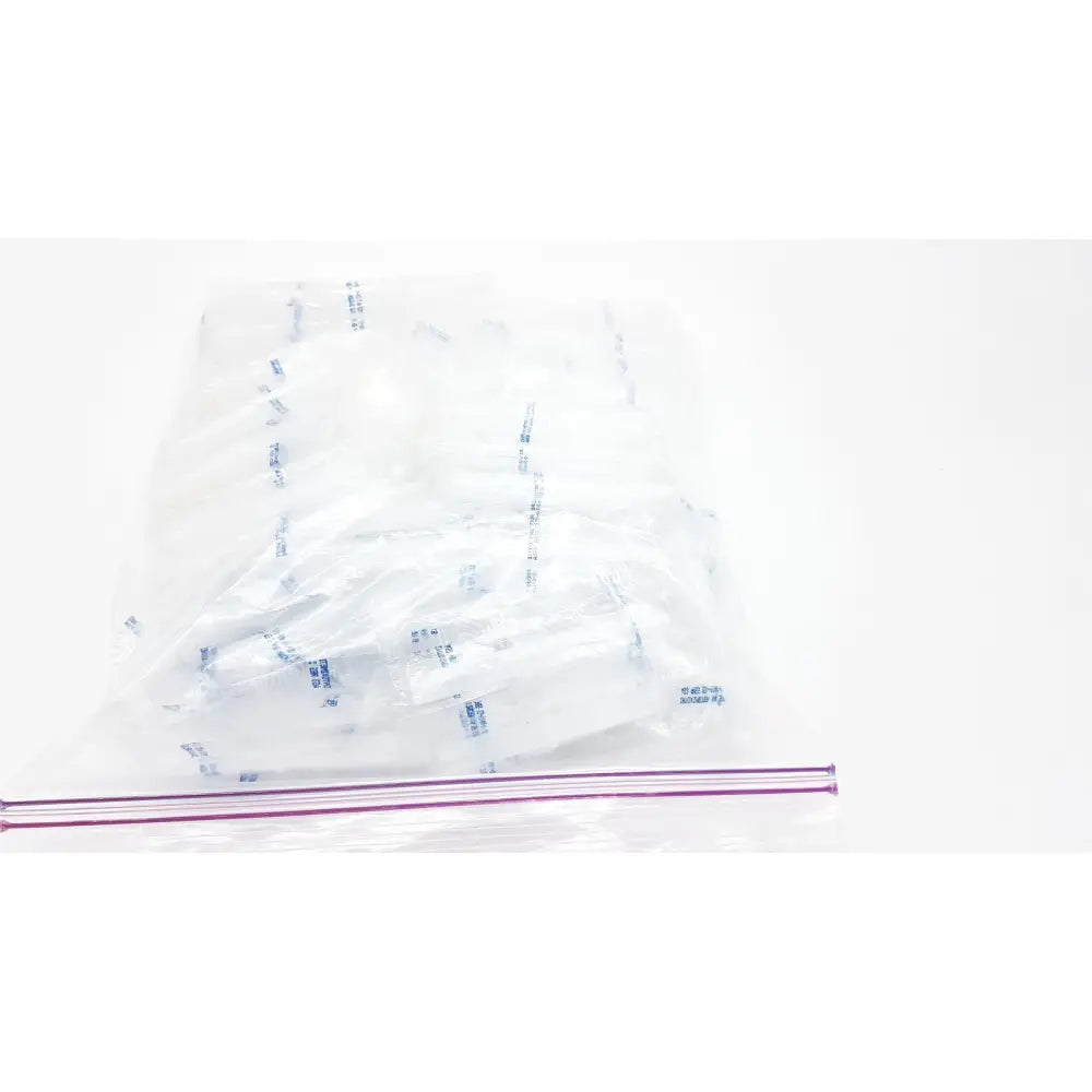 Clear plastic zip-top bag containing multiple individually wrapped white disposable dental things for single use