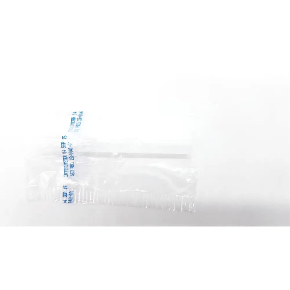 Clear plastic-wrapped disposable dental things lollipop stick with blue printed text on the wrapper