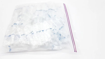 Clear plastic disposable dental things bag with purple zip-top seal for hygienic storage and easy access