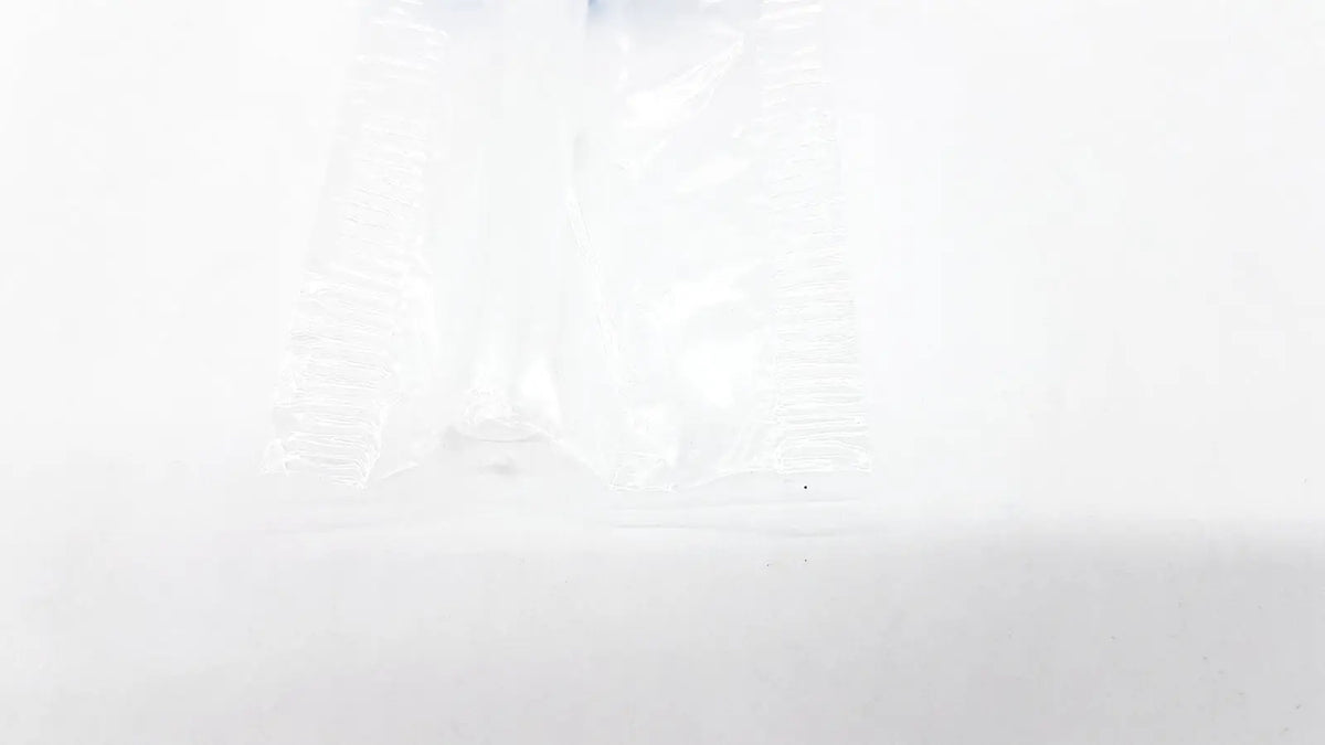 Clear plastic disposable dental things bag with crinkled texture and subtle light reflections for reuse medical use
