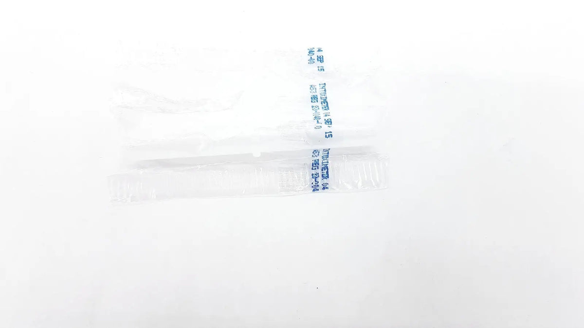 Clear plastic-wrapped disposable dental floss packet with blue printed text from disposable dental things packaging