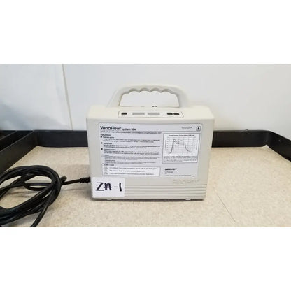 Off-white plastic djo aircast venaflow 30a portable blood flow device with molded handle and black power cord