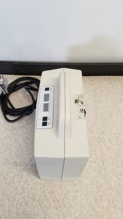 White medical-grade oxygen concentrator with control panel and handle for djo aircast venaflow 30a vascular system
