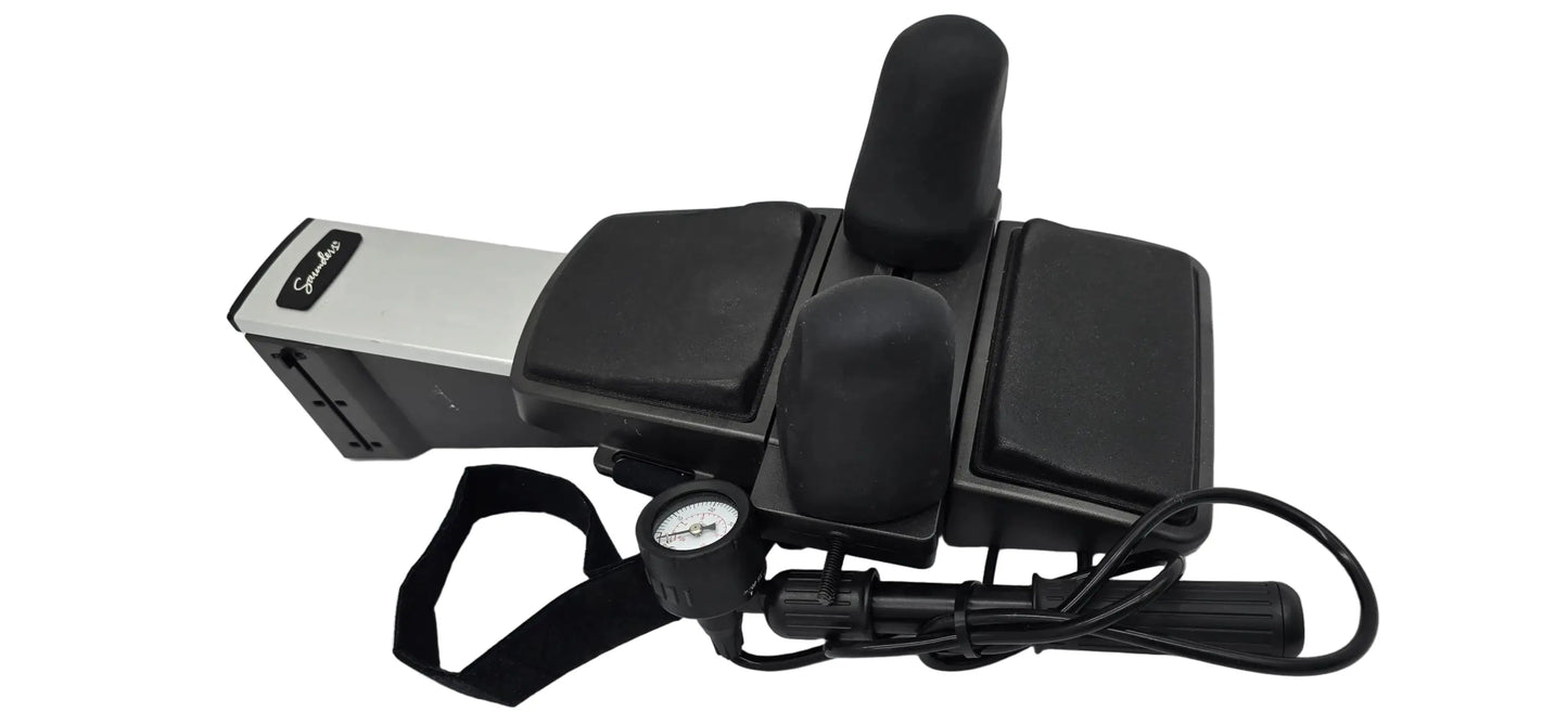 Black and silver DJO Global Saunders cervical home traction device with padded sections, adjustable headrests, and pressure gauge