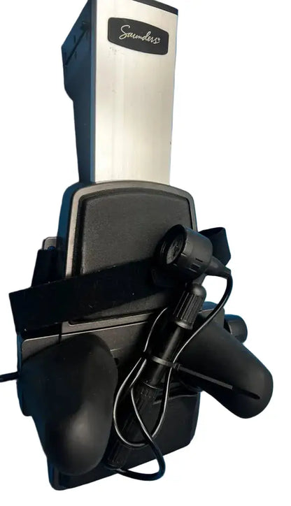 Black and silver soundcore wireless gaming headset with microphone and adjustable headband shown with cervical home traction device base unit