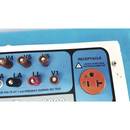 Orange three-prong receptacle on blue and white dni nevada medtester 5000 electrical safety analyzer panel