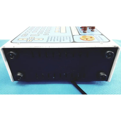 White rectangular dni nevada medTester 5000 electrical safety analyzer with black feet and copper connectors control panel