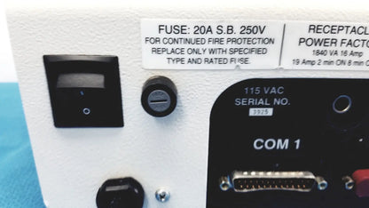 White industrial control panel with black switch and labeled ports including com 1 on dni nevada medTester 5000 electrical safety analyzer