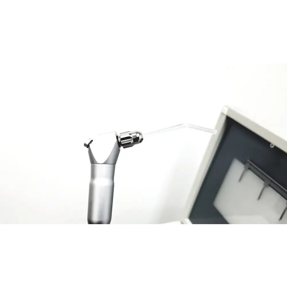 Silver dental handpiece with curved transparent nozzle and metallic handle in dntl works p-2000 dental delivery unit with midwest rhino