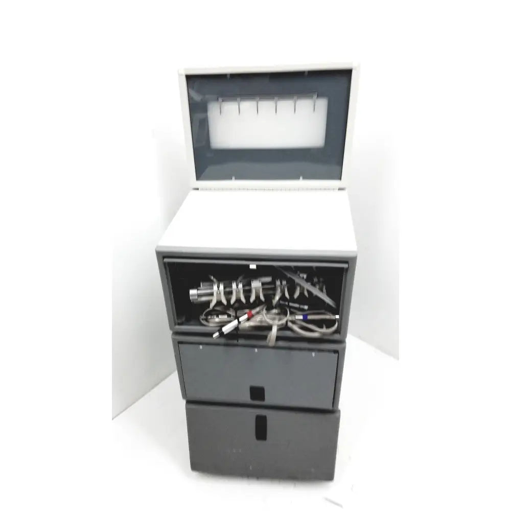 Gray metal dental delivery unit dntl works p-2000 with open top compartment and drawers for tubes and instruments