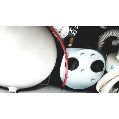 Light blue metal dental delivery unit with black ports and bolts connected by red hose to white cylindrical tank by dntl works