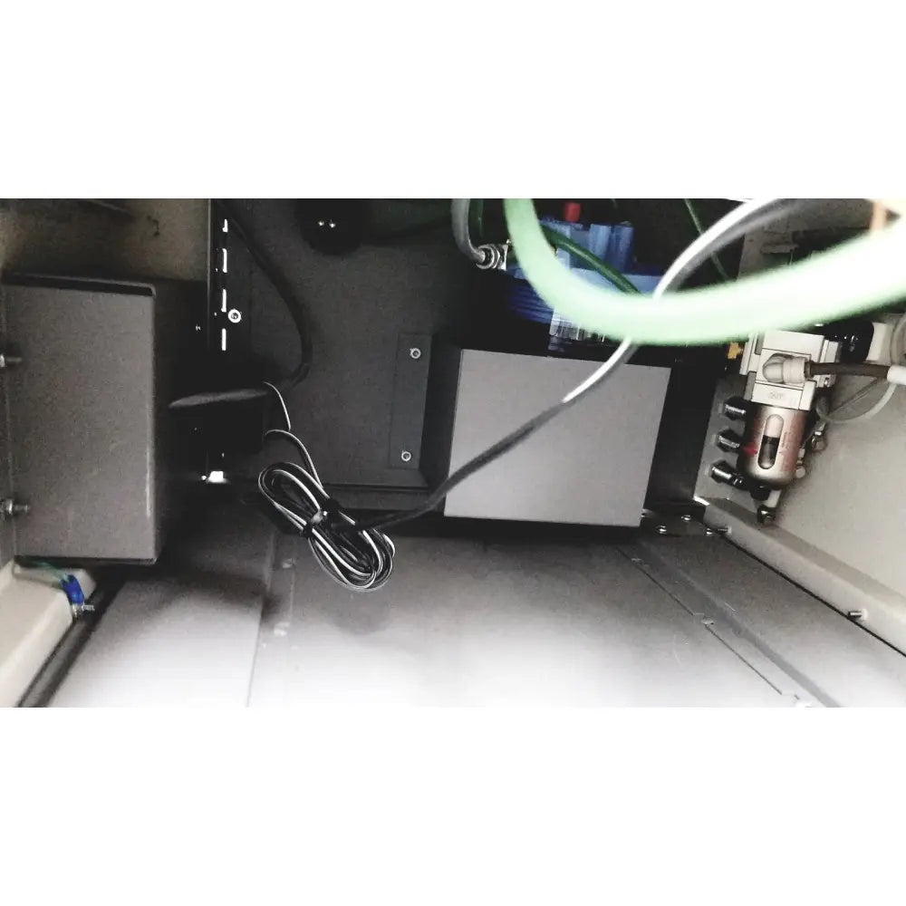 Black coiled cable with small connector at the back side of dntl works p-2000 dental delivery unit with midwest rhino