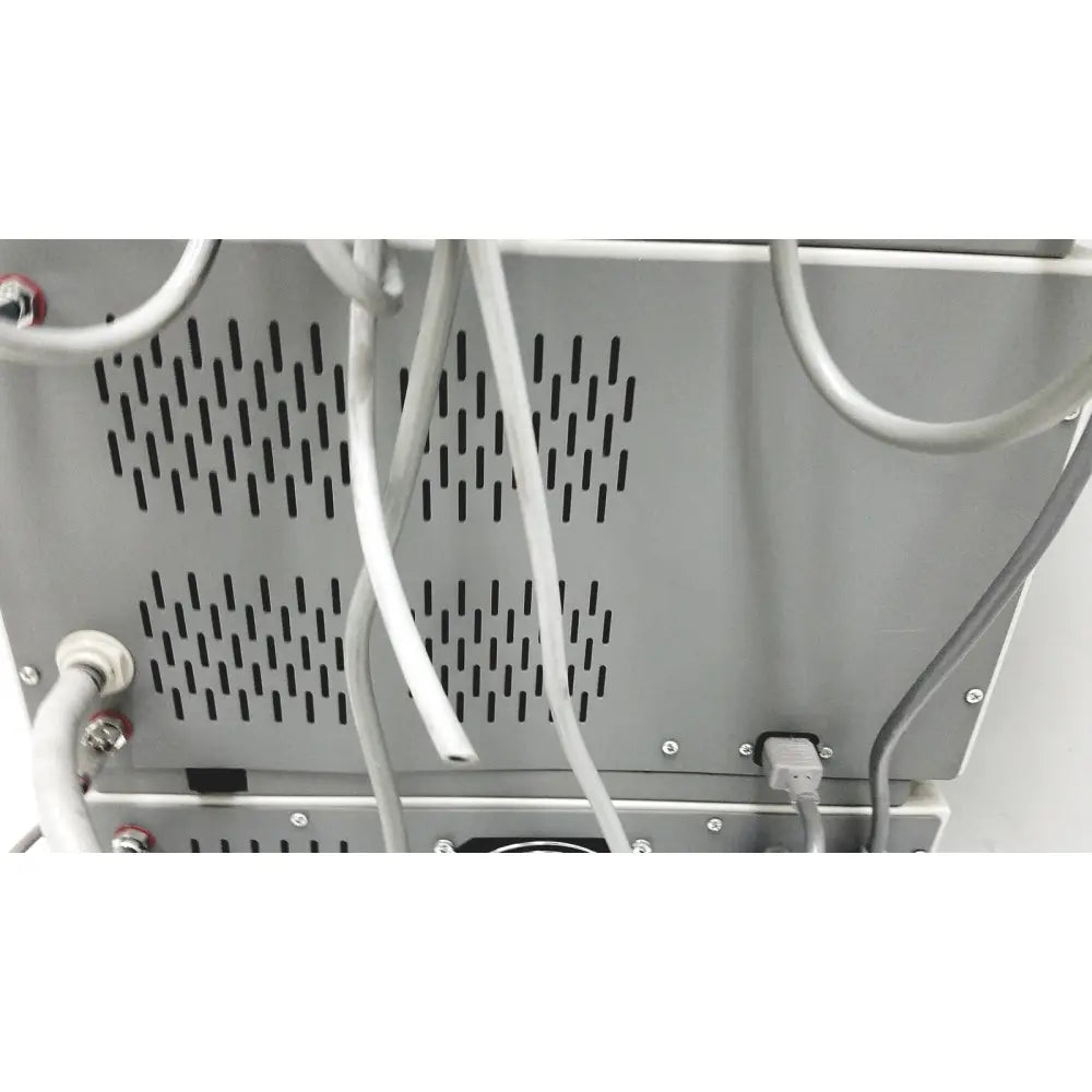 Gray metallic dntl works p-2000 dental delivery unit back with vertical ventilation panels and multiple white cable connections