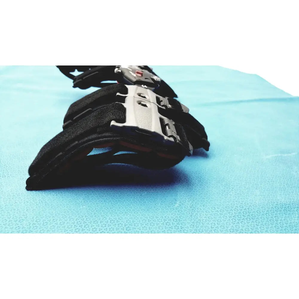 Black and silver donjoy flexion elbow arm post-op brace with adjustable straps and metallic hardware for adult use
