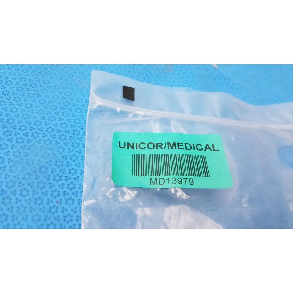 Small black unicor medical component sealed in clear bag for donjoy x-act rom adjustable arm brace support