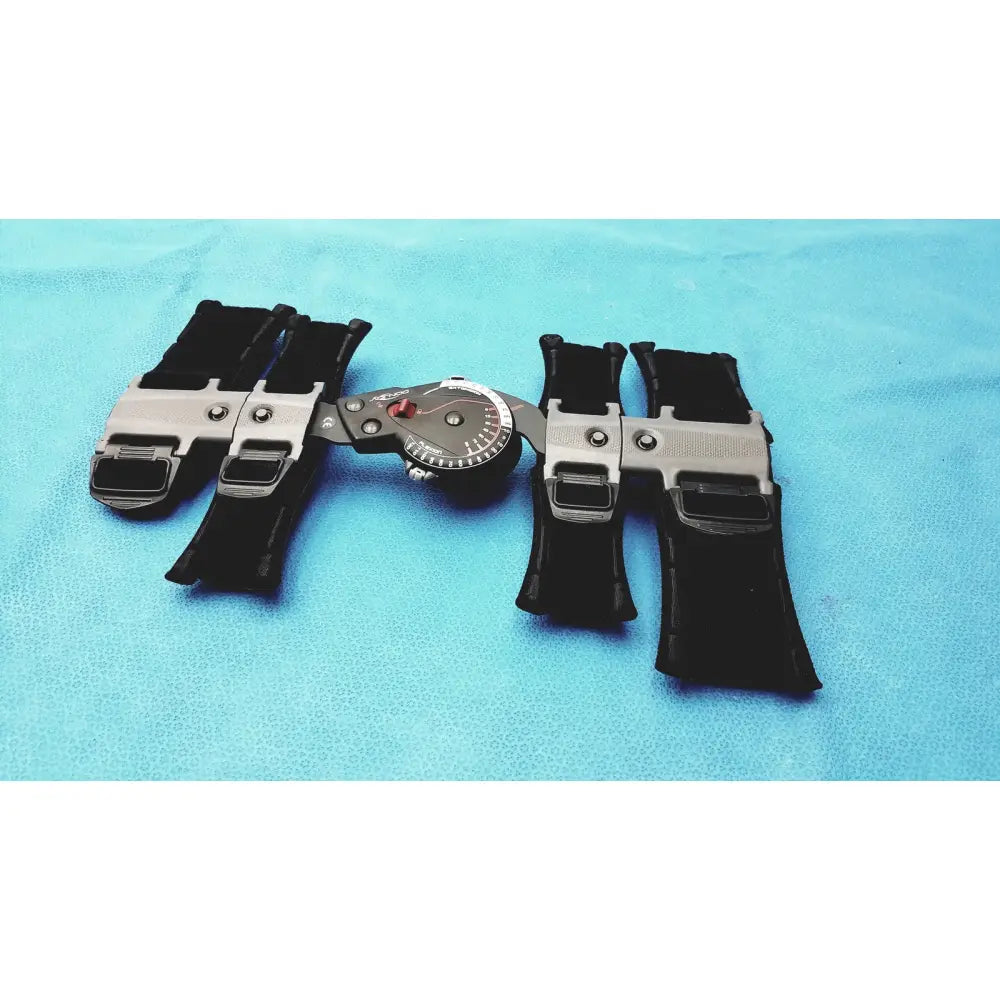 DonJoy X-Act ROM adjustable arm brace in silver and black with central dial for precise flexion and extension support