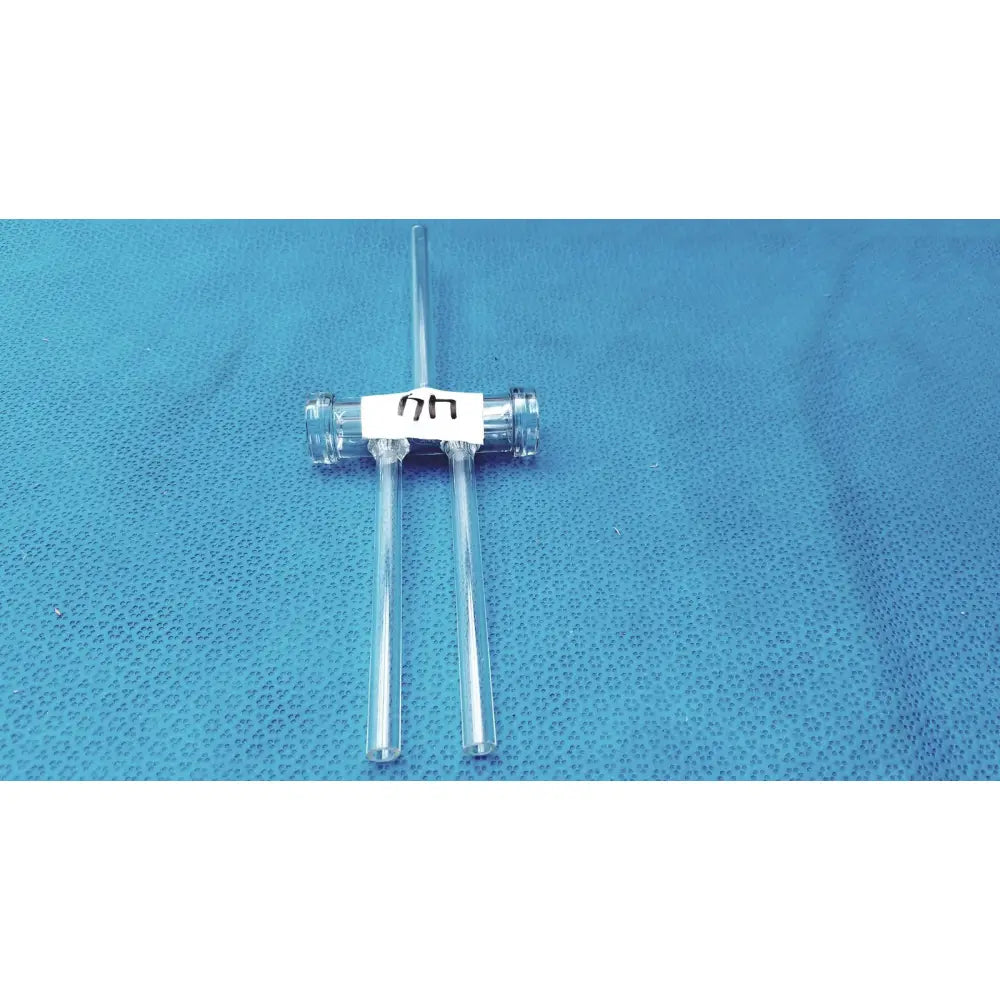 Clear double oblique bore glass stopcock made of borosilicate with a central connector and two side tubes for precision control