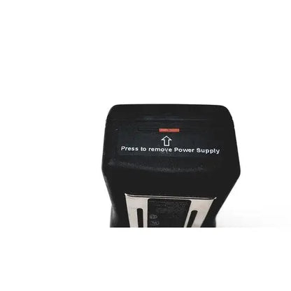 Black rectangular power supply unit with red indicator light on the back of drager multi-gas monitor for reuse medical purposes