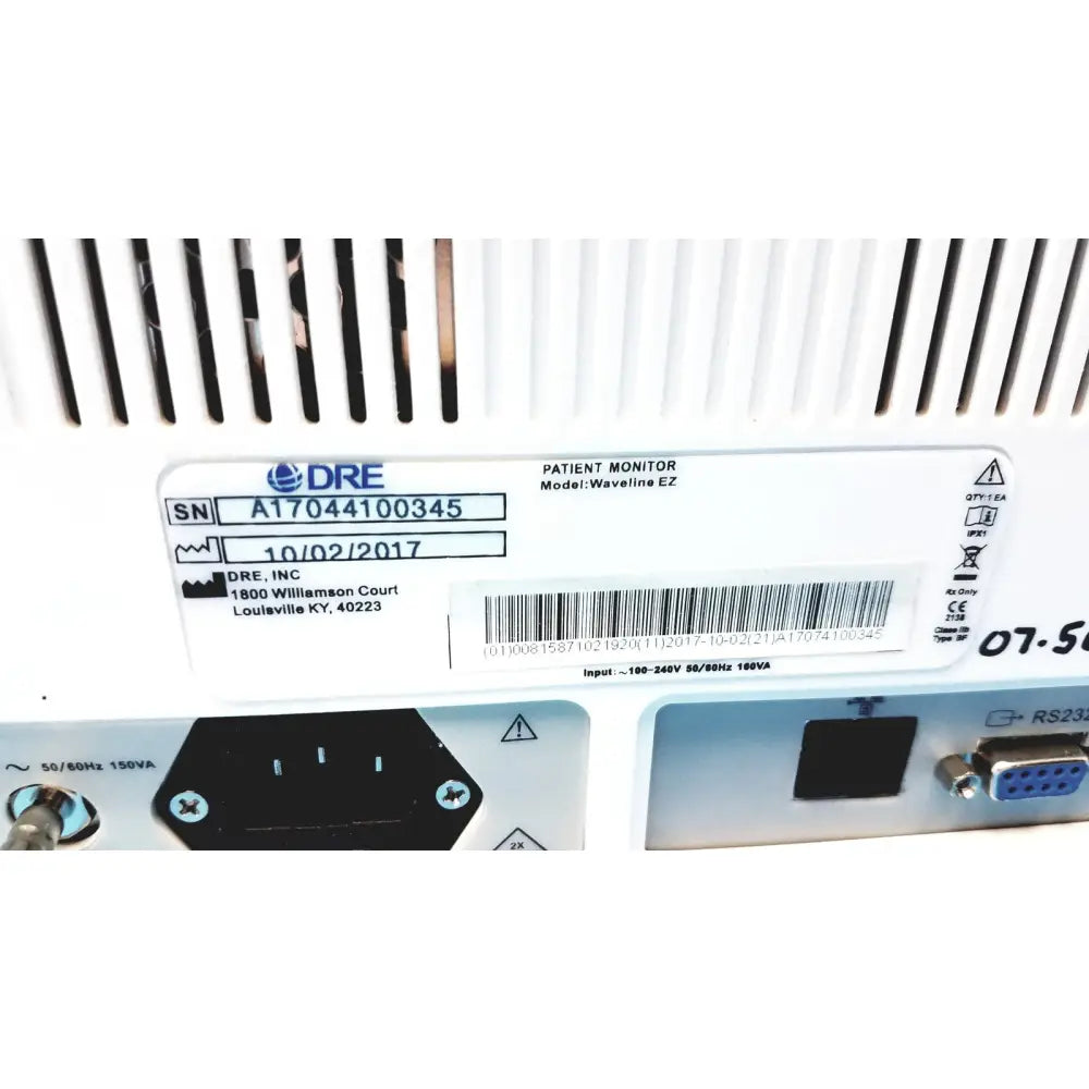 White plastic back side of dre ez waveline portable patient monitor with ventilation slits and barcode label visible