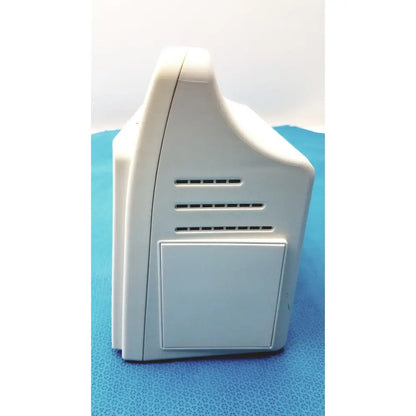 White plastic back panel of dre ez waveline waveline portable patient monitor with rectangular ventilation slots