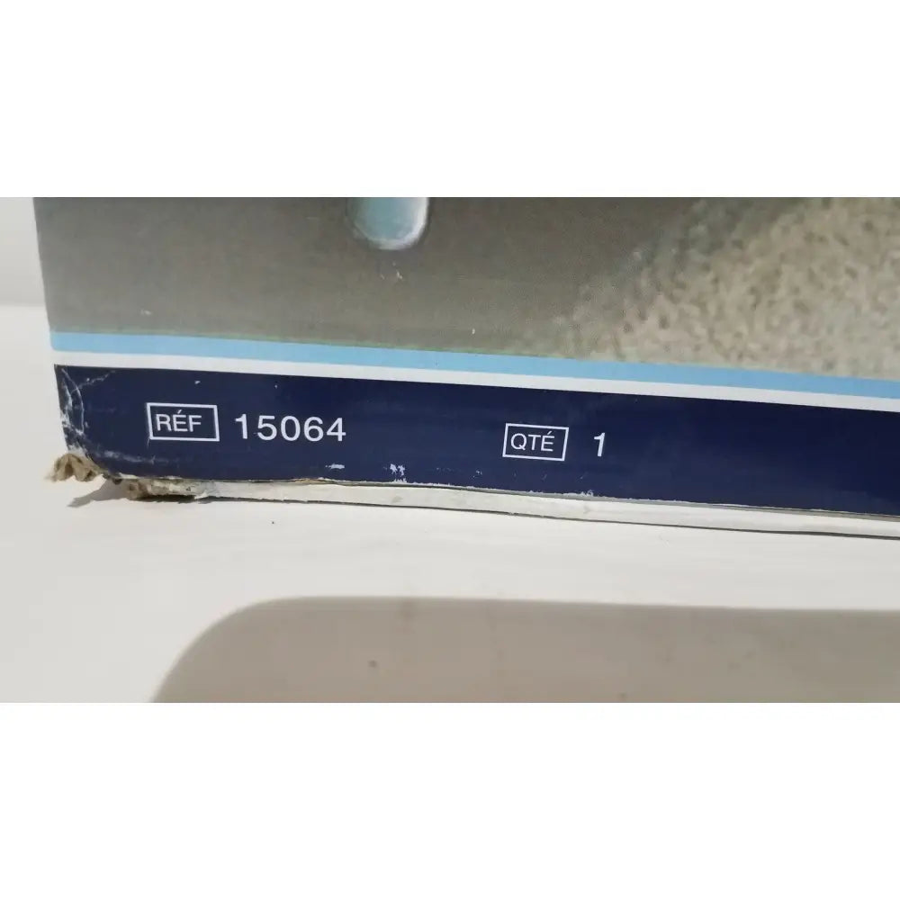 Close-up of the bottom edge of a cardboard box labeled reference 15064 containing drive medical home bed assist grab rail
