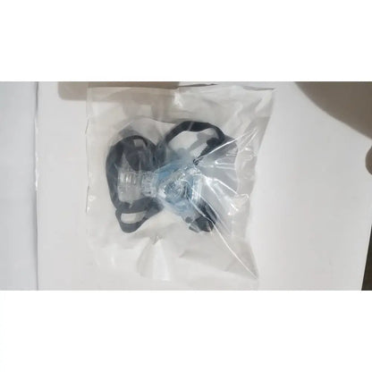 Clear plastic face mask with black elastic straps shown alongside drive rtl12027ra raised toilet seat with removable arms