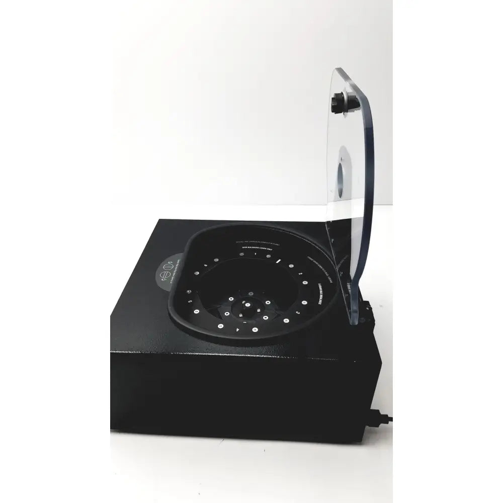Black rectangular drucker diagnostics dash apex 24 centrifuge with transparent lid and multi-sample circular rotor