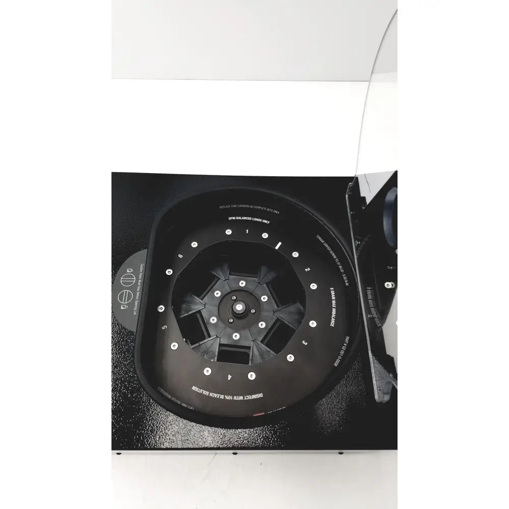 Black laboratory centrifuge with numbered slots and white labeling for fast sample processing drucker diagnostics dash apex