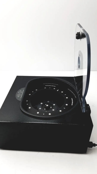 Black rectangular drucker diagnostics dash apex 24 centrifuge with transparent lid and multi-sample circular rotor