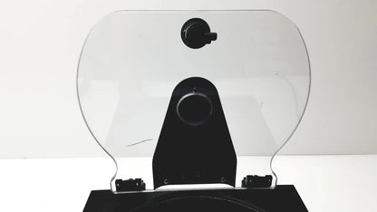 Clear plastic motorcycle windshield with black mounting bracket and adjustment knobs on drucker diagnostics dash apex 24 centrifuge