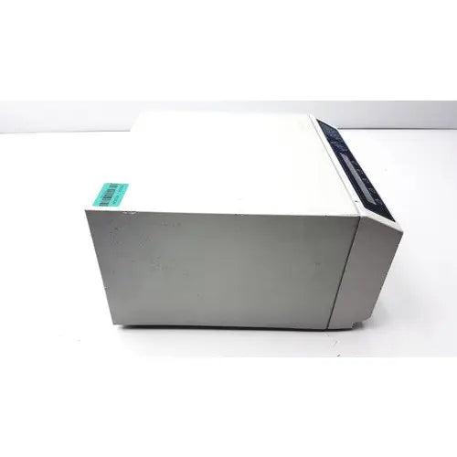 White and gray dynatech mrx microplate reader with a black control panel on top right corner for laboratory use