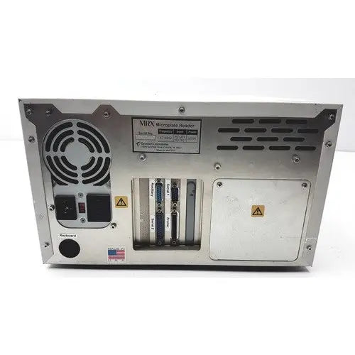 Silver metallic server rack with multiple ports and ventilation grilles on the back of dynatech mrx microplate reader