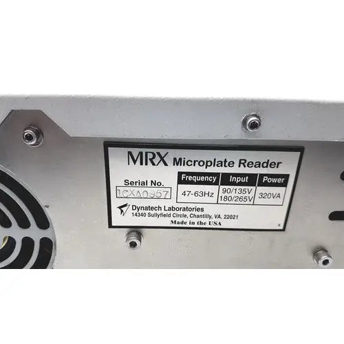 Silver metallic dynatech mrx microplate reader with black label showing technical specifications and manufacturer details