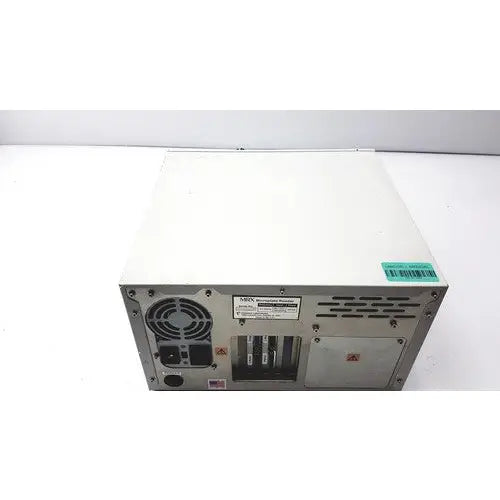 Back side of white metal dynatech mrx microplate reader server rack with ventilation grilles and circular fan