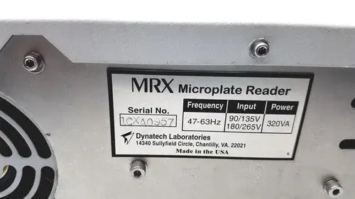 Silver metallic dynatech mrx microplate reader with black label showing technical specifications and manufacturer details