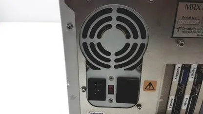 Silver metallic dynatech mrx microplate computer tower with circular vent power and reset buttons labeled expansion slots