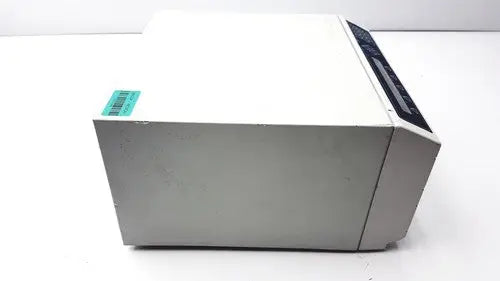White and gray dynatech mrx microplate reader with a black control panel on top right corner for laboratory use