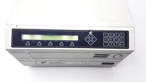 White plastic dynatech mrx microplate reader with black control panel featuring lcd screen and numeric keypad