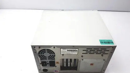 Back side of white metal dynatech mrx microplate reader server rack with ventilation grilles and circular fan