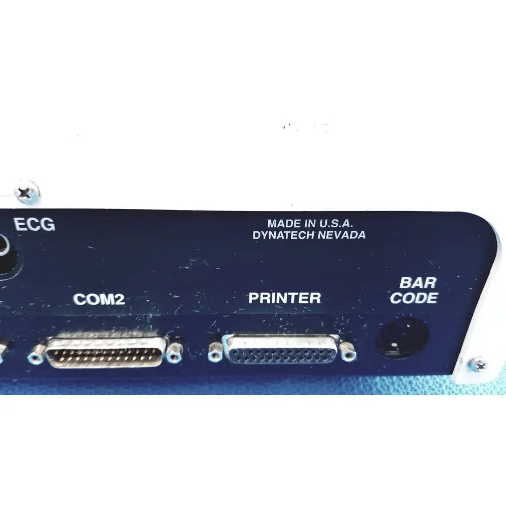 Back panel of dark blue dynatech nevada medtester 5000 with silver db-25 connectors for biomedical electrical safety testing