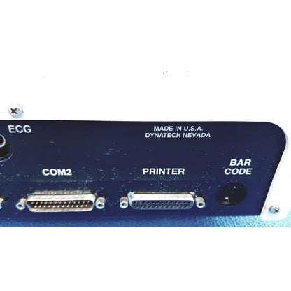 Back panel of dark blue dynatech nevada medtester 5000 with silver db-25 connectors for biomedical electrical safety testing