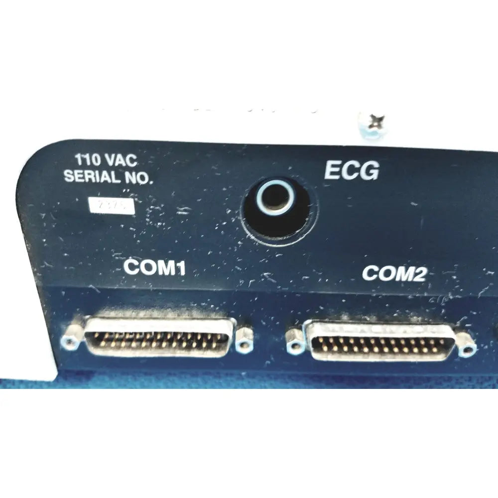 Black medical device panel with labeled ecg com1 and com2 ports on back side of dynatech nevada medtester 5000 biomedical electrical safety analyzer