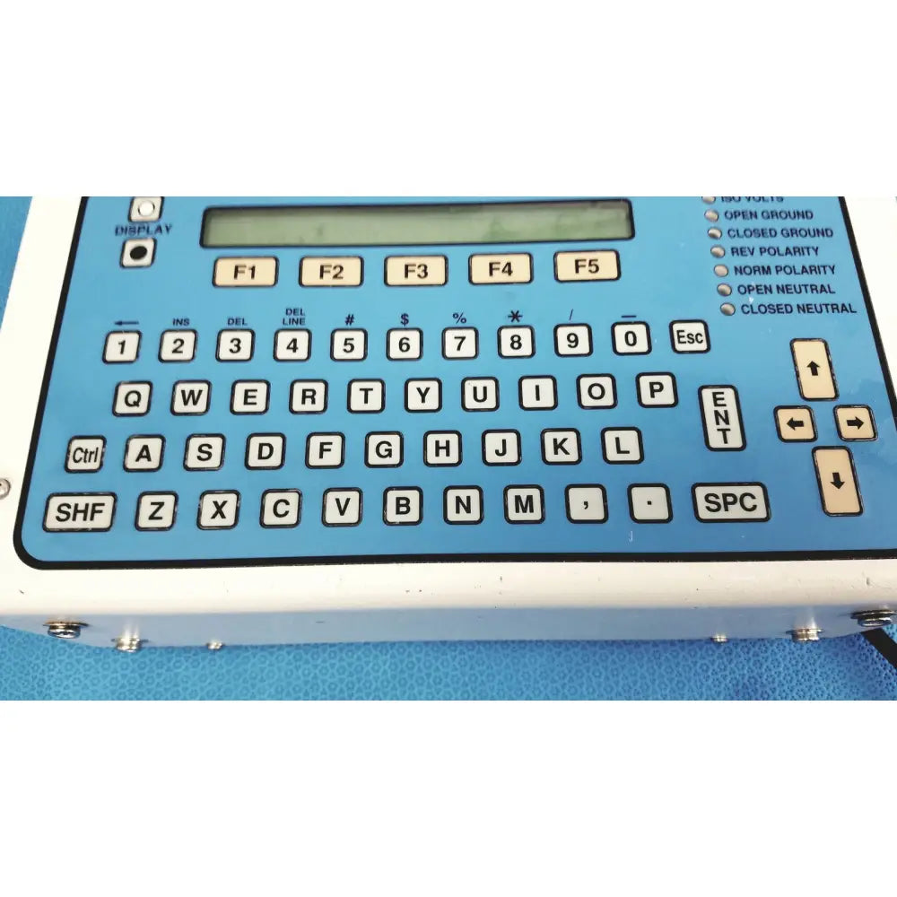Blue plastic keypad with white lettering and digital display on dynatech nevada medtester 5000 biomedical electrical safety analyzer