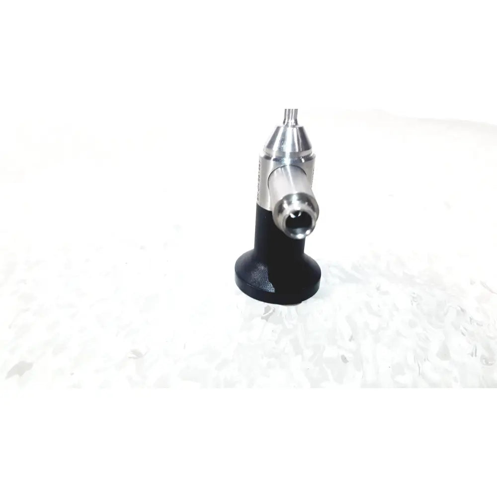 Black and silver Dyonics 30 degree JH 251467 dental handpiece with textured grip designed for reuse medical applications