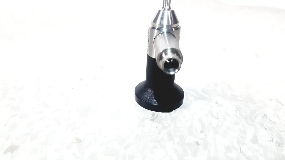 Black and silver Dyonics 30 degree JH 251467 dental handpiece with textured grip designed for reuse medical applications