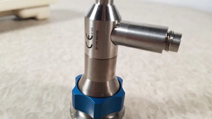 Silver metallic industrial valve dyonics 30 degree sn hr 268768 with blue hexagonal base and reuse medical certification markings