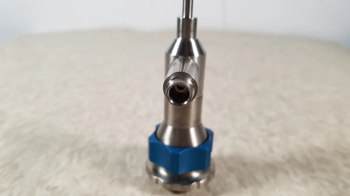 Silver Dyonics 30 degree SN HR 268768 surgical instrument with blue hexagonal base designed for reuse medical applications