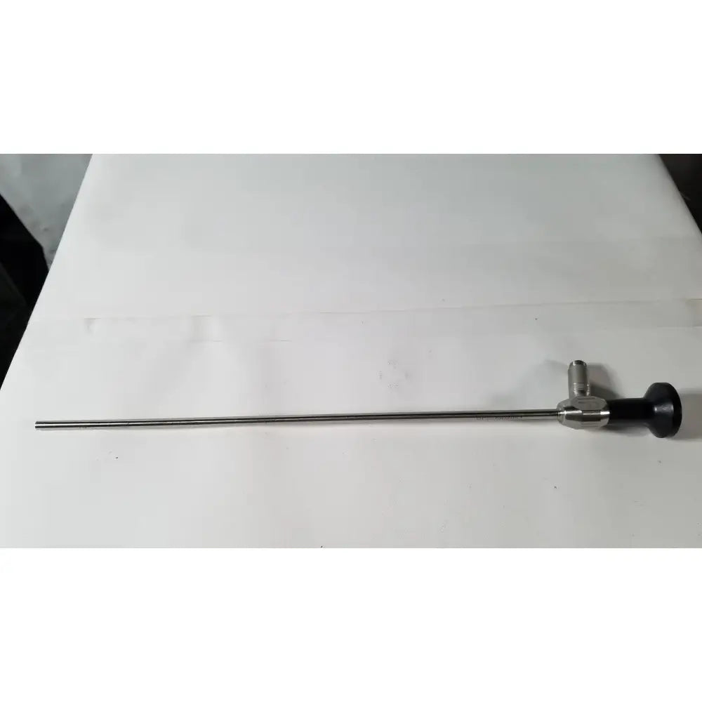 Dyonics 7207951 silver 5.5mm 0 degree autoclavable laparoscope with black ergonomic handle and metallic joints for reuse medical procedures