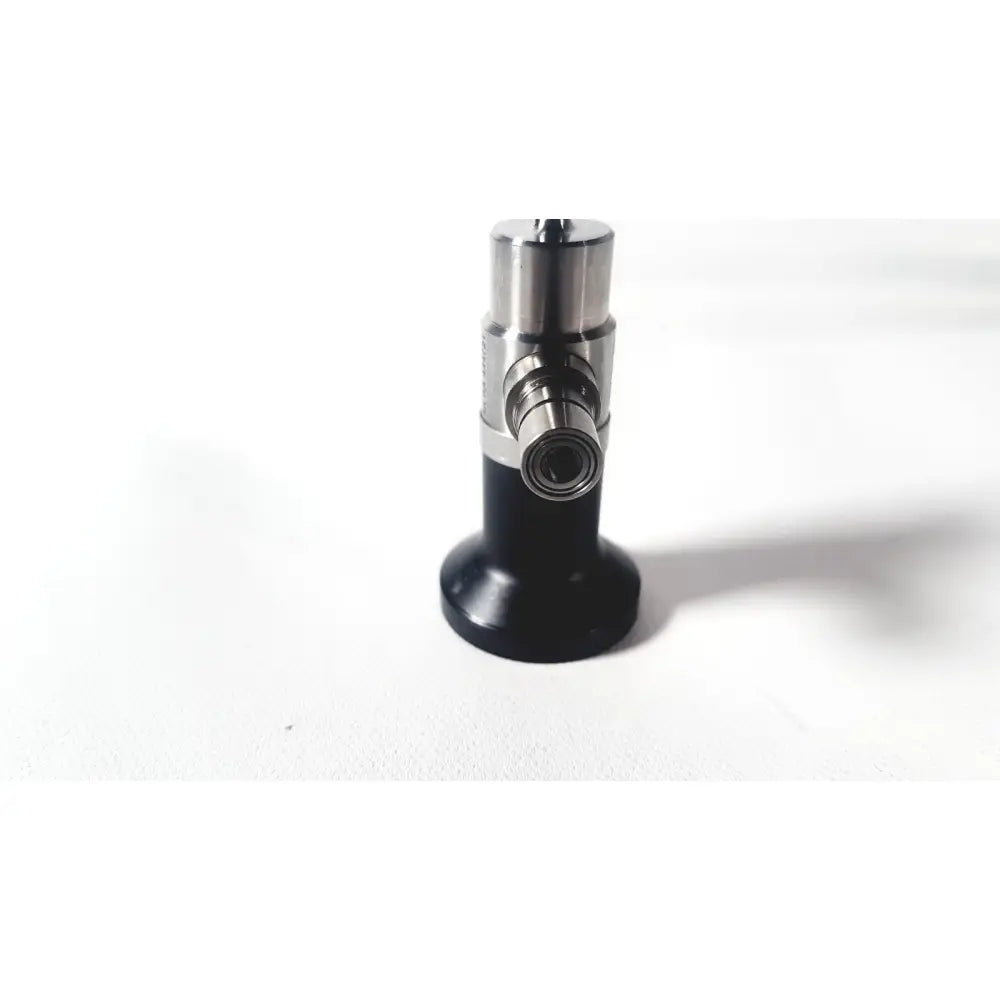 Black and silver dyonics autoclavable arthroscope sinuscope with cylindrical handle and metallic lens housing for reuse medical use