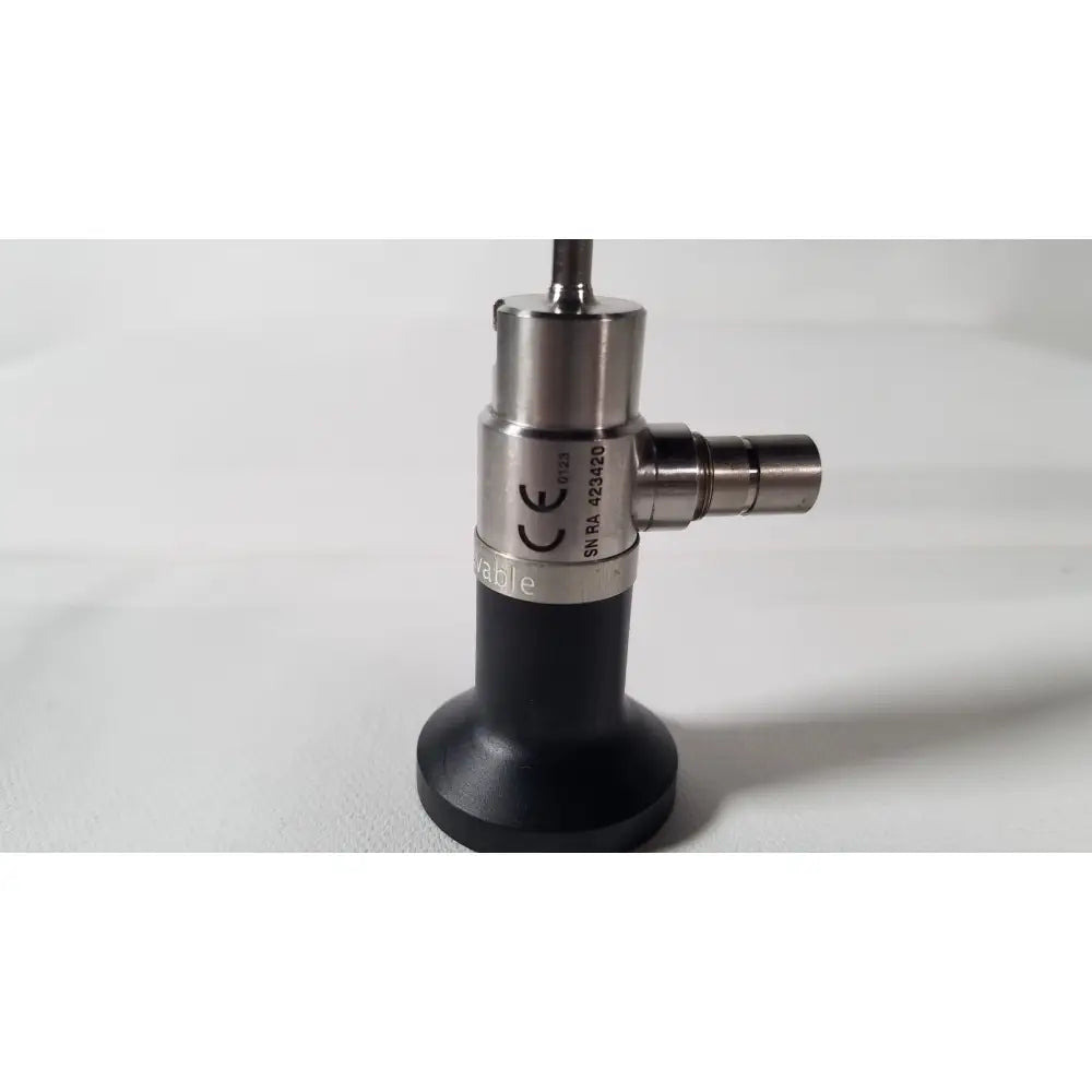 Silver and black dyonics autoclavable 4mm 70 degree arthroscope with cylindrical metallic body and textured grip section